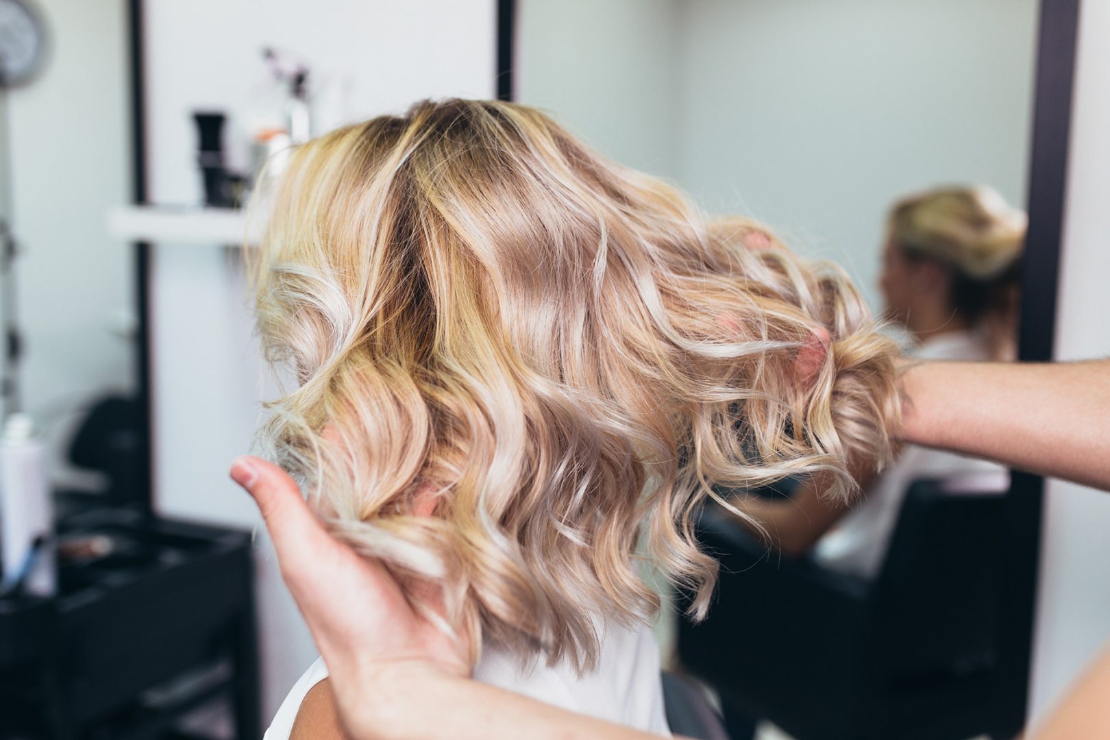 Beautiful hairstyle of young woman after dying hair and making h